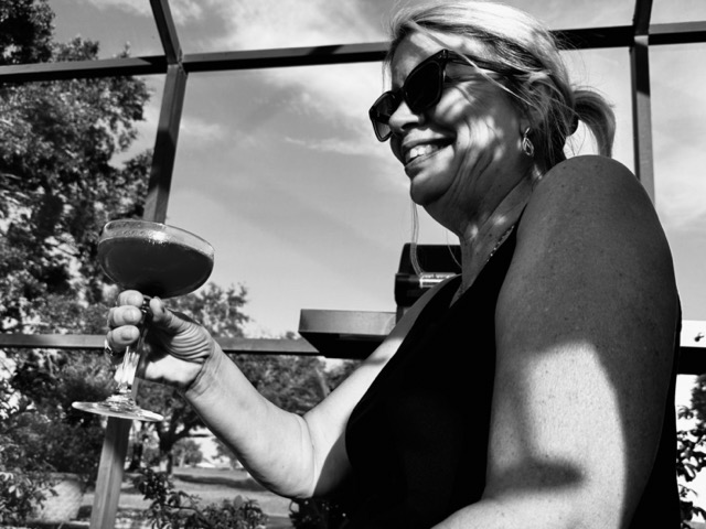 Kim enjoying cocktail poolside with a cocktail. Wisconsin style beer cheese dip spread by Chef Alexis Hernandez. 