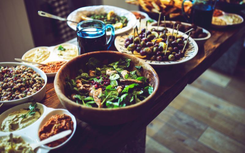 Table with salads, olives appetizers