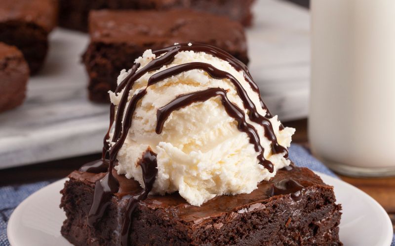I meant to make a triple-layer cake. I brought boxed brownies instead—finished with espresso powder, star anise, and the confidence to call it dessert.