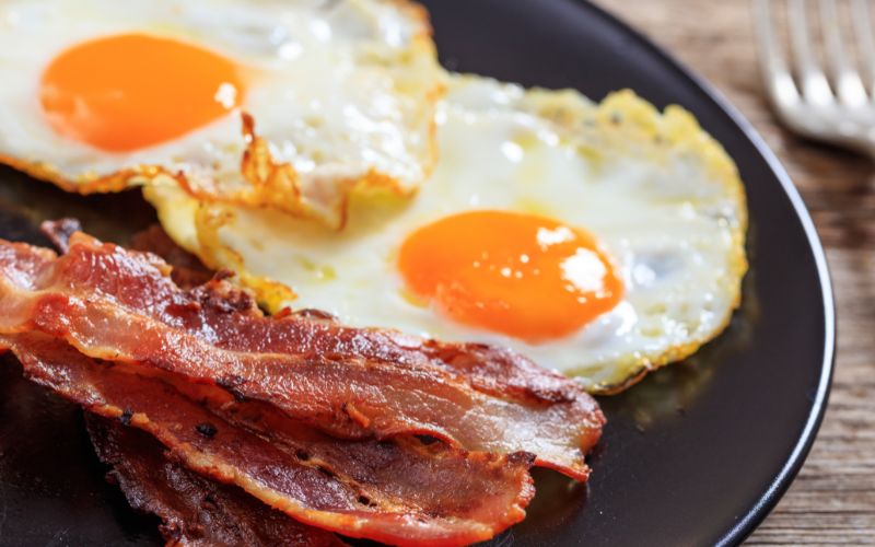 Fried eggs and bacon on a plate