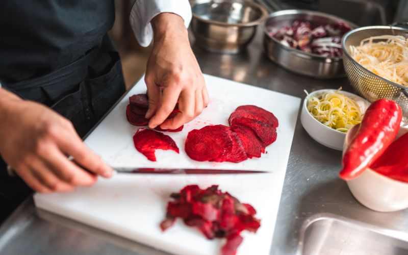 Slicing Beets for a salad with pistachios