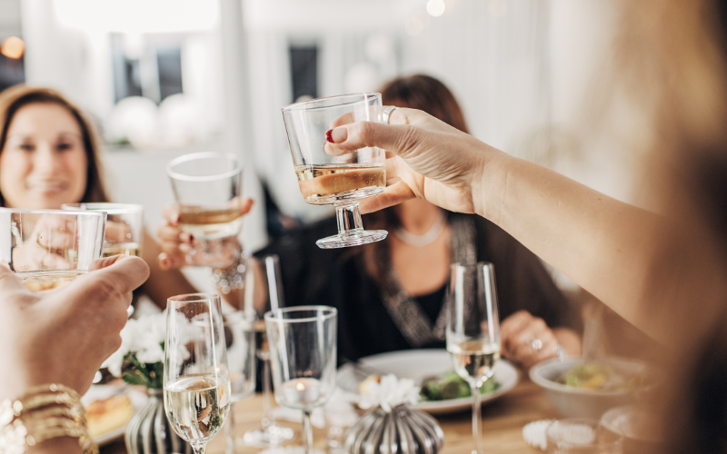Hosting done right clinking wine glasses