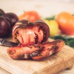Sliced heirloom tomatoes on a cutting board