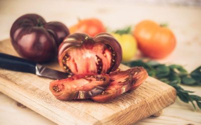 Sliced heirloom tomatoes on a cutting board