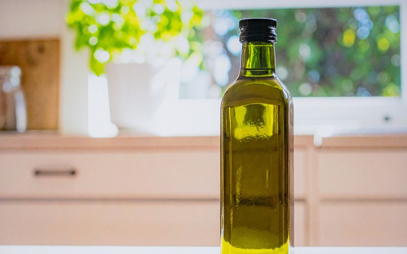 Bottle of Olive oil on a kitchen counter