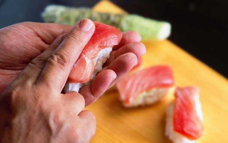 Warm Rice being served with sushi