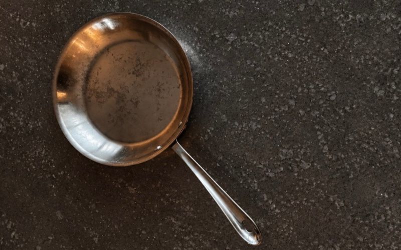 Chef Alexis Hernandez’s longtime All-Clad sauté pan, featured in the story behind What the Pan Remembers